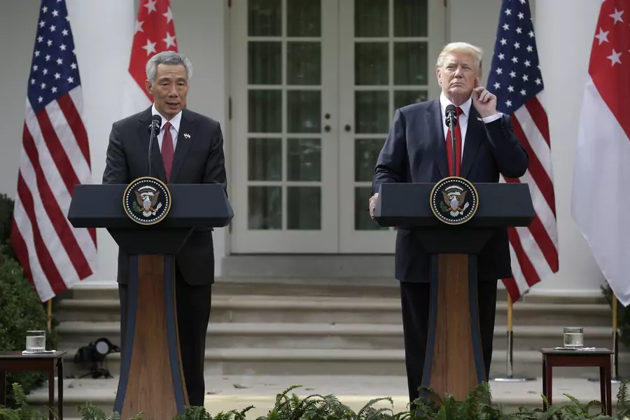 Singapore's Prime Minister Lee Hsien Loong and U.S. President Donald J. Trump give joint statements in the Rose Garden of the White House in Washington, DC on October 23, 2017.