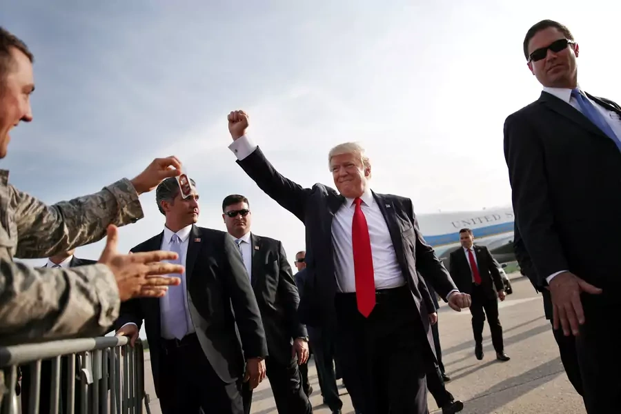 U.S. President Donald Trump reacts as he arrives at Harrisburg international airport.