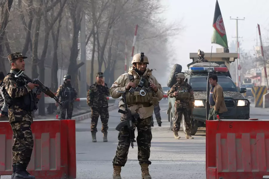 Afghan security forces keep watch at a check point close to a compound of Afghanistan's national intelligence agency in Kabul, Afghanistan. December 25, 2017.