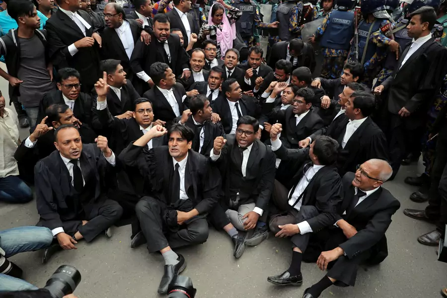 Lawyers supporting the Bangladesh Nationalist Party (BNP) shout slogans as they sit on a street during a protest in Dhaka, Bangladesh February 8, 2018.