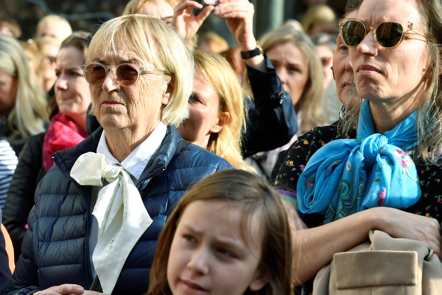 Women wear bows at a demonstration in Stockholm, Sweden April, 2018.