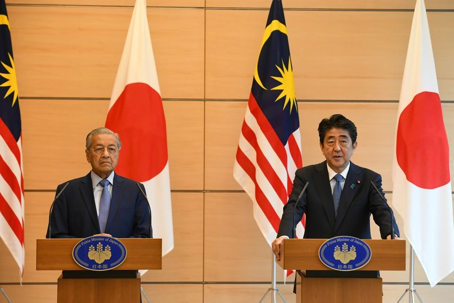 Malaysian Prime Minister Mahathir Mohamad delivers a speech beside his Japanese counterpart Shinzo Abe during their joint press remarks at Abe's official residence in Tokyo, Japan on June 12, 2018. 