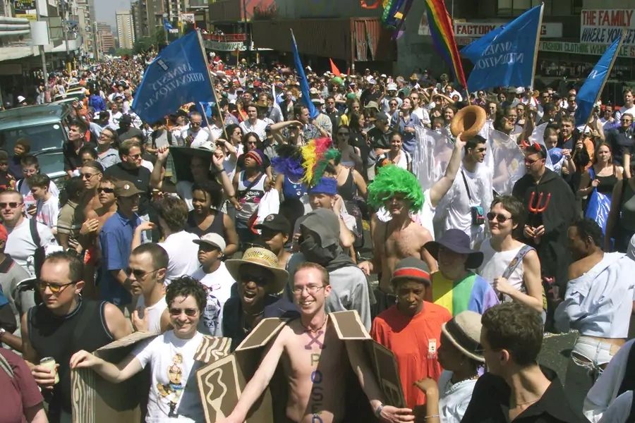 Nearly 30,000 bisexuals, gays lesbians and other allies of diversity march 10 km (6 miles) through the streets of downtown Johannesburg on September 25, 1999, to commemorate the country's 10th Pride Parade.