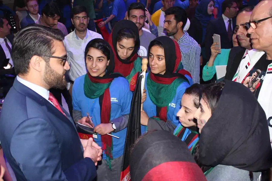 Ambassador Hamdullah Mohib with the Afghan Girls' Robotics Team. 