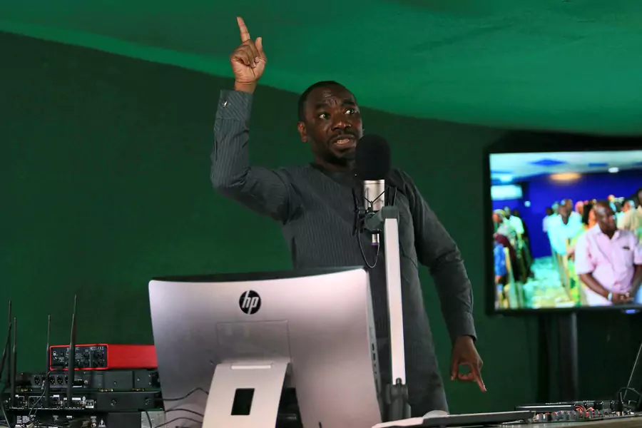 Ahmad Isah, the host of Nigeria's Brekete Family radio program, speaks to his audience at Human Rights Radio in Abuja, Nigeria June 26, 2018.