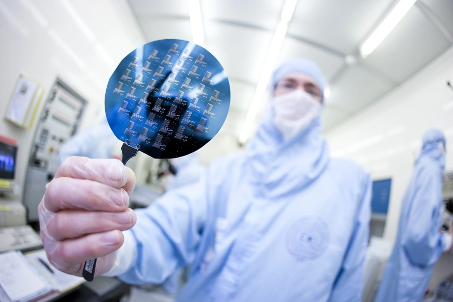 A scientist presents a silicon wafer during the media in May 2011.