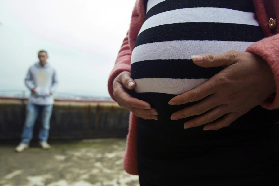 Lu Libing and his pregnant wife, Mu, pose for pictures during an interview with Reuters at their home in Ganzhou, Jiangxi province March 13, 2014. 