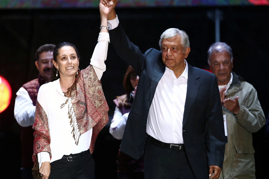 Claudia Sheinbaum (L), candidate for Mexico City Mayor, and Mexican presidential candidate Andres Manuel Lopez Obrador gesture during a closing campaign rally.