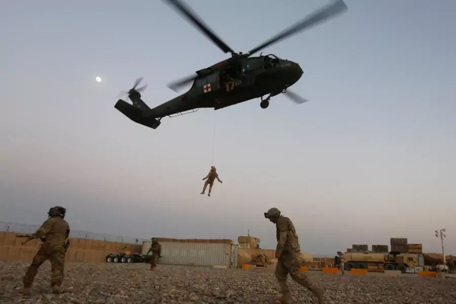 U.S. service members take part in a helicopter Medevac exercise.