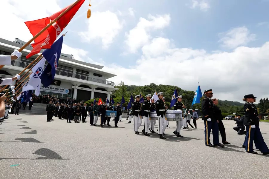 South Korean and the United Nations Command (UNC) honor guards carry the remains of the United Nations Command (UNC) and South Korean soldiers who were killed in North Korea in the 1950-53 Korean War during the mutual repatriation ceremony.