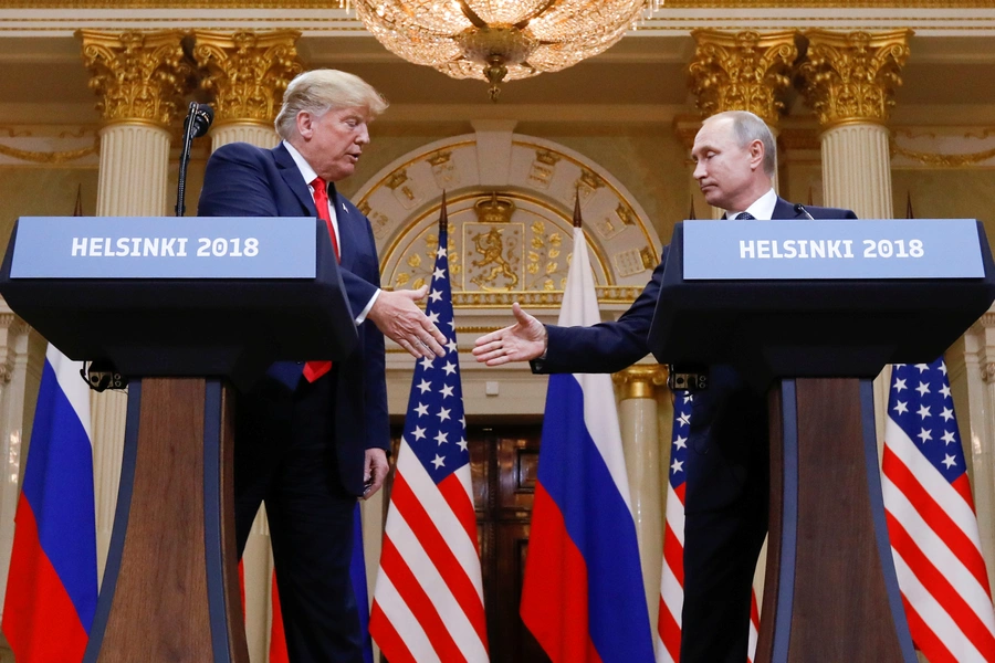 U.S. President Donald Trump and Russia's President Vladimir Putin shake hands during a joint news conference after their meeting in Helsinki, Finland, July 16, 2018. 