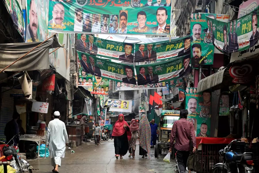 A street is decorated with the flags and banners of political parties ahead of a general election in Rawalpindi, Pakistan, on July 23, 2018.