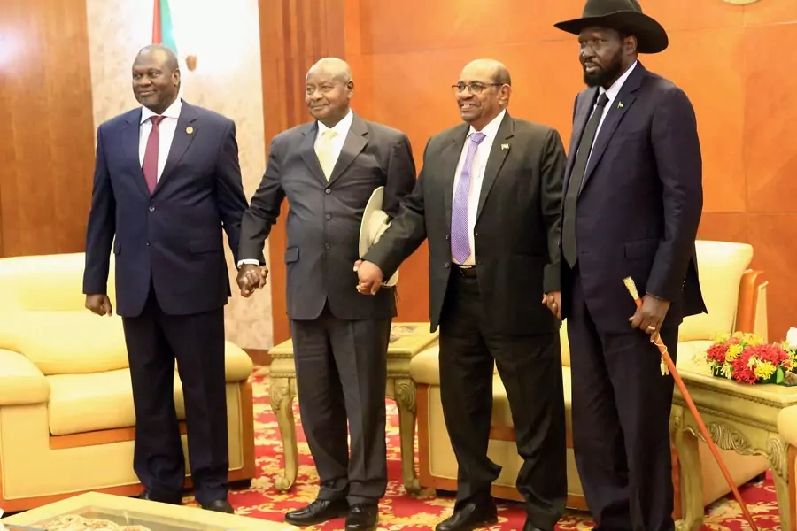 Sudan's President Omar Al-Bashir with Uganda's President Yoweri Museveni, South Sudan's President Salva Kiir, and South Sudan rebel leader Riek Machar at a South Sudan peace meeting to a civil war that broke out in 2013, in Khartoum, Sudan June 25, 2018.