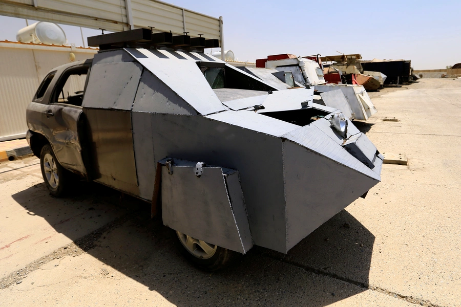 Vehicles used for suicide car bombings, made by Islamic State militants, are seen at Federal Police headquarters after being confiscated in Mosul. 