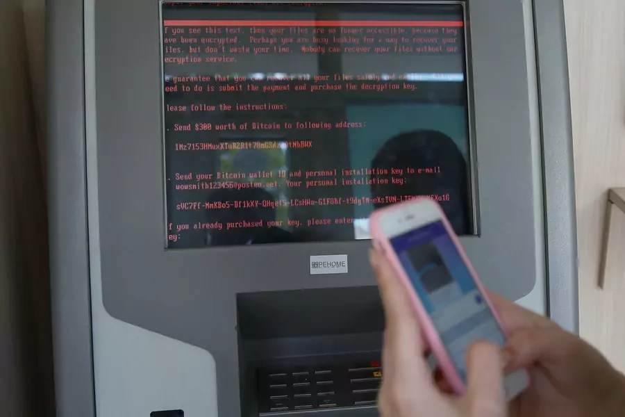A message demanding money is seen on a monitor of a payment terminal at a branch of Ukraine's state-owned bank Oschadbank after Ukrainian institutions were hit by the NotPetya malware in June 2017.