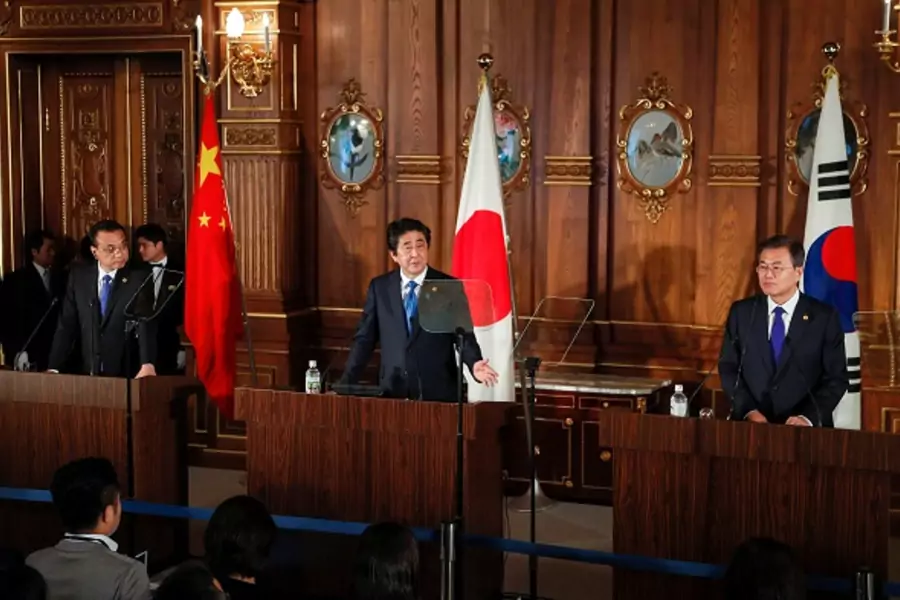 Japanese Prime Minister Shinzo Abe, Chinese Prime Minister Li Keqiang and South Korean President Moon Jae-in attend their joint news conference after their trilateral summit talks in Tokyo, May 9, 2018.