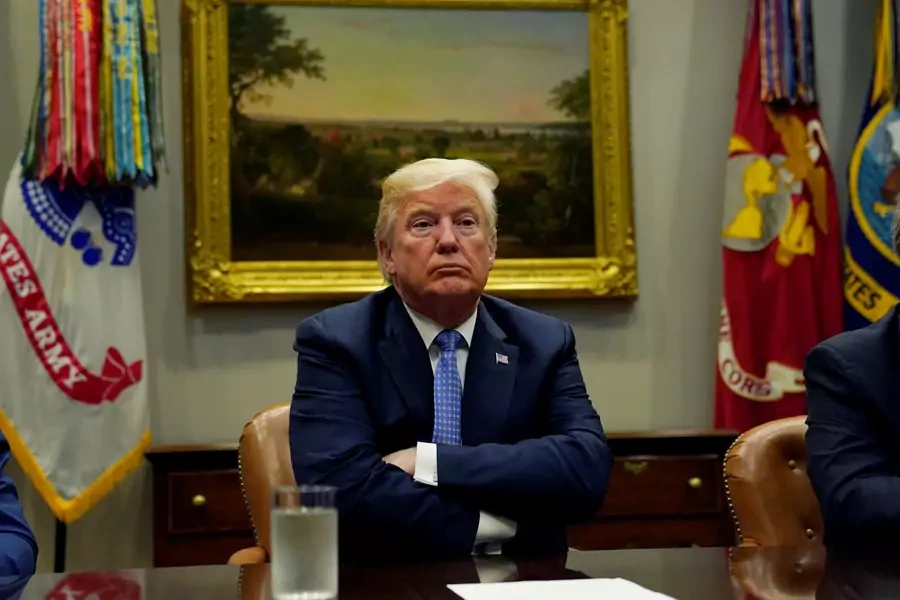 U.S. President Donald Trump looks up while holding a roundtable on the Foreign Investment Risk Review Modernization Act at the White House in Washington, U.S., August 23, 2018. 