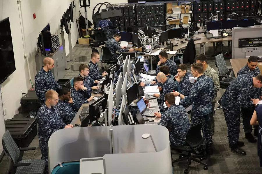 Sailors work together at a joint cyber training center during an April 2017 exercise at Fort Meade.