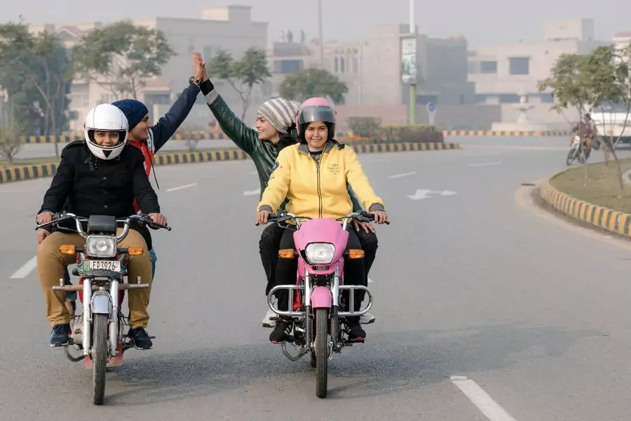 Pakistani women bikers participate in the "Women on Wheels" initiative, launched by Punjab's Strategic Reform Unit.
