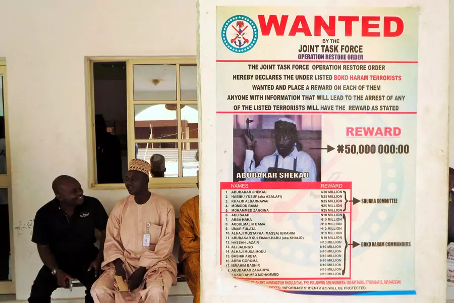 A poster advertising for the search of Boko Haram leader Abubakar Shekau is pasted on a wall in Baga village on the outskirts of Maiduguri, in the northeastern state of Borno, Nigeria May 13, 2013.