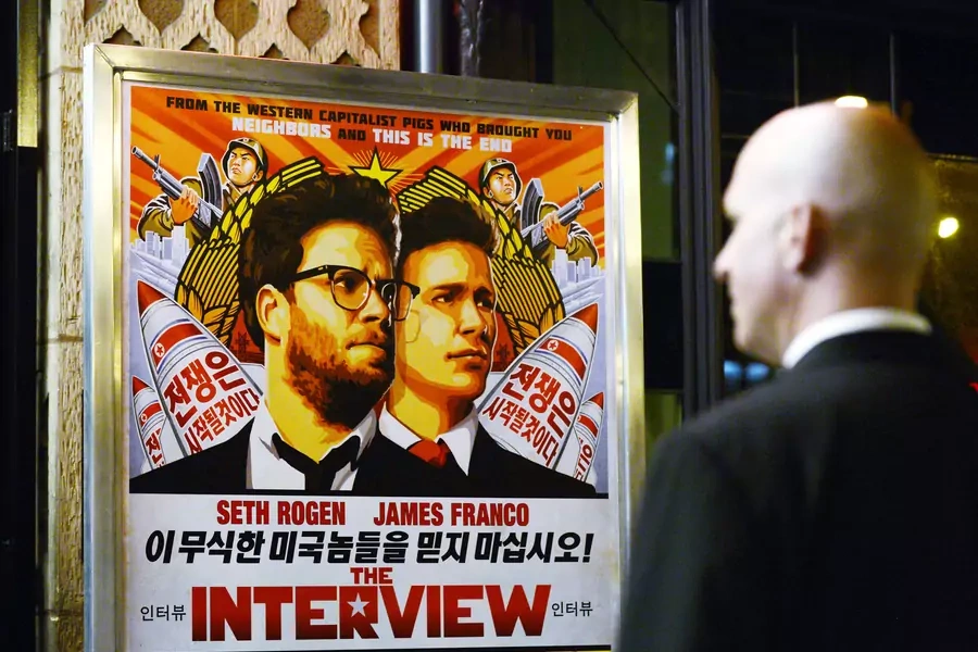 A security guard stands at the entrance of United Artists theater during the premiere of the film "The Interview" in Los Angeles on December 11, 2014.