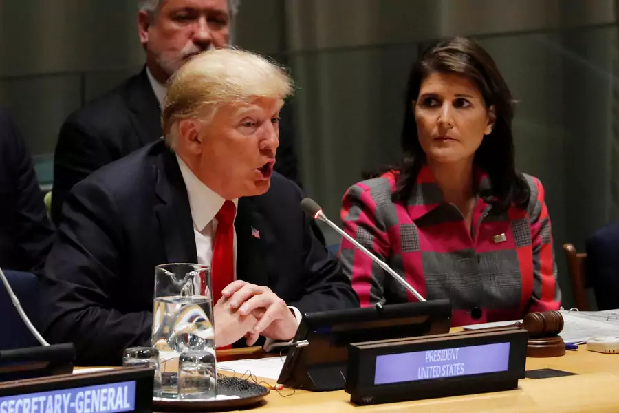 U.S. President Donald J. Trump speaks as UN Ambassador Nikki Haley looks on at the United Nations Global Call to Action on the World Drug Problem during the UN General Assembly in New York on September 24, 2018.