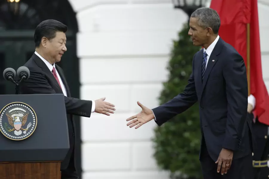 U.S. President Barack Obama (R) shakes hands with Chinese President Xi during a welcoming ceremony for the Chinese leader at the White House for an official State Visit in Washington D.C. on September 25, 2015. 
