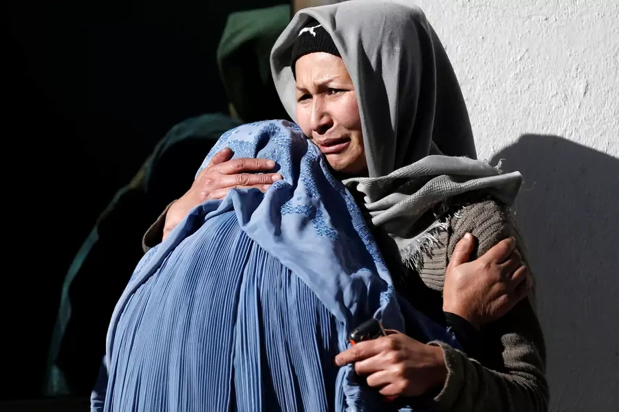 Afghan women mourn inside a hospital compound after a suicide attack in Kabul, Afghanistan.
