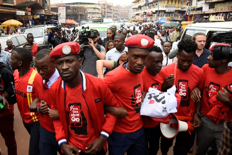 Ugandan musician turned politician, Robert Kyagulanyi (C), also known as Bobi Wine, leads activists during a demonstration against new taxes including a levy on access to social media platforms in Kampala, Uganda July 11, 2018.