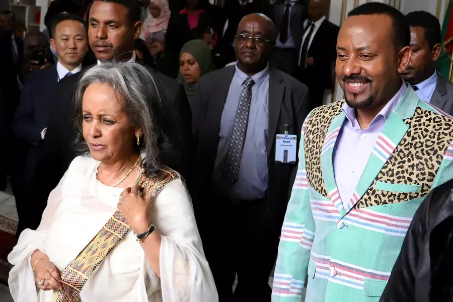 Ethiopia's Prime Minister Abiy Ahmed walks with the newly elected President Sahle-Work Zewde, as they leave House of Peoples' Representatives in Addis Ababa, Ethiopia on October 25, 2018