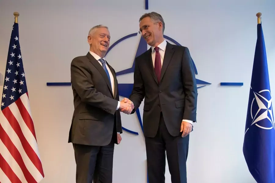 U.S. Secretary of Defense James Mattis poses with NATO Secretary General Jens Stoltenberg during a NATO defence ministers meeting at the Alliance headquarters in Brussels, Belgium, October 3, 2018.