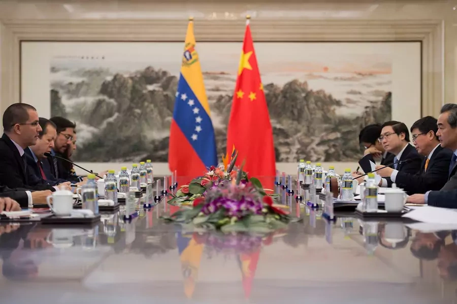 Venezuelan Foreign Minister Jorge Arreaza (2nd L) talks with China's Foreign Minister Wang Yi (2nd R) during a meeting at the Ministry of Foreign Affairs in Beijing on December 22, 2017. 