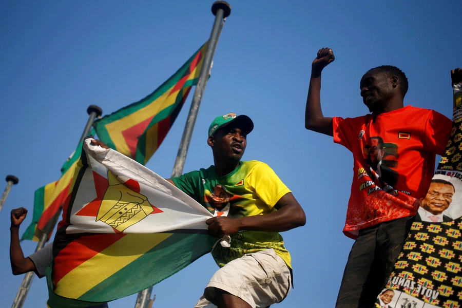 Supporters of President Emmerson Mnangagwa's ruling ZANU-PF party celebrate after the Constitutional Court confirmed Mnangagwa's disputed July 30 election victory in Harare, Zimbabwe August 24, 2018.