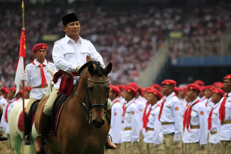 Prabowo Subianto, presidential candidate of the Great Indonesia Movement (Gerindra) Party, rides a horse during a campaign rally at a stadium in Jakarta on March 23, 2014.