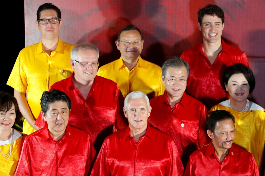 U.S. Vice President Mike Pence poses for a family photo with APEC leaders at at a gala dinner during the APEC Summit in Port Moresby, Papua New Guinea on November 17, 2018.