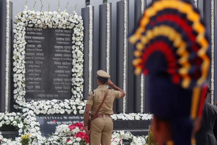 A policeman pays his respects at a memorial to mark the tenth anniversary of the November 26, 2008 attacks in Mumbai, India.