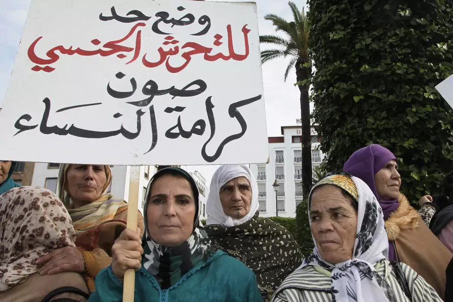 Women from various regions of Morocco protest against violence towards women, in Rabat. The placard reads, "Stopping harassment gives dignity for women." 