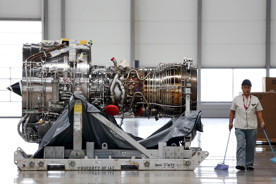 An employee walks past an engine at the Airbus factory in Tianjin, China, August 12, 2015.