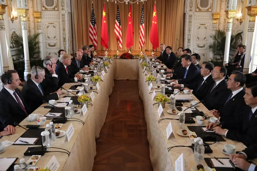 U.S. President Donald Trump (4thL) holds a bilateral meeting with China's President Xi Jinping (5thR) at Trump's Mar-a-Lago estate in Palm Beach, Florida, U.S., April 7, 2017