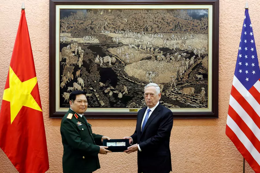 Vietnam's Defence Minister Ngo Xuan Lich (L) presents war relics of a U. S. serviceman to U.S. Secretary of Defense Jim Mattis after their meeting in Hanoi, Vietnam on January 25, 2018.