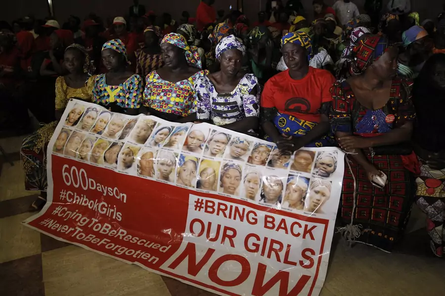 Parents of the Chibok girls hold a "Bring Back Our Girls" banner during their meeting with Nigeria's President Muhammadu Buhari at the presidential villa in Abuja, Nigeria, on January 14, 2016. The Chibok kidnapping remains the most high profile .