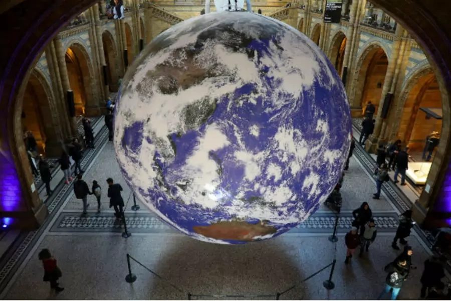 A giant Earth artwork is displayed in the Hintze Hall inside the Natural History Museum in London, Britain, November 30, 2018. 