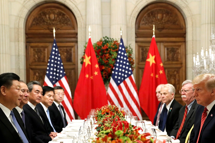 U.S. President Donald Trump, Trump's national security advisor John Bolton, and Chinese President Xi Jinping attend a working dinner after the Group of Twenty leaders summit in Buenos Aires, Argentina, on December 1, 2018.