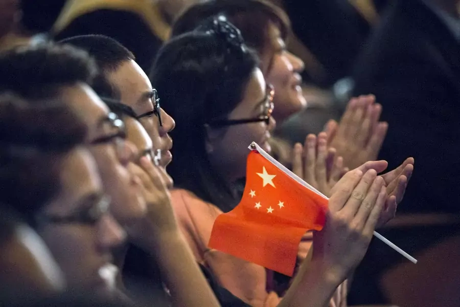 Students clap while Chinese President Xi Jinping delivers a speech during a visit to Lincoln High School in Tacoma, Washington, September 23, 2015. 