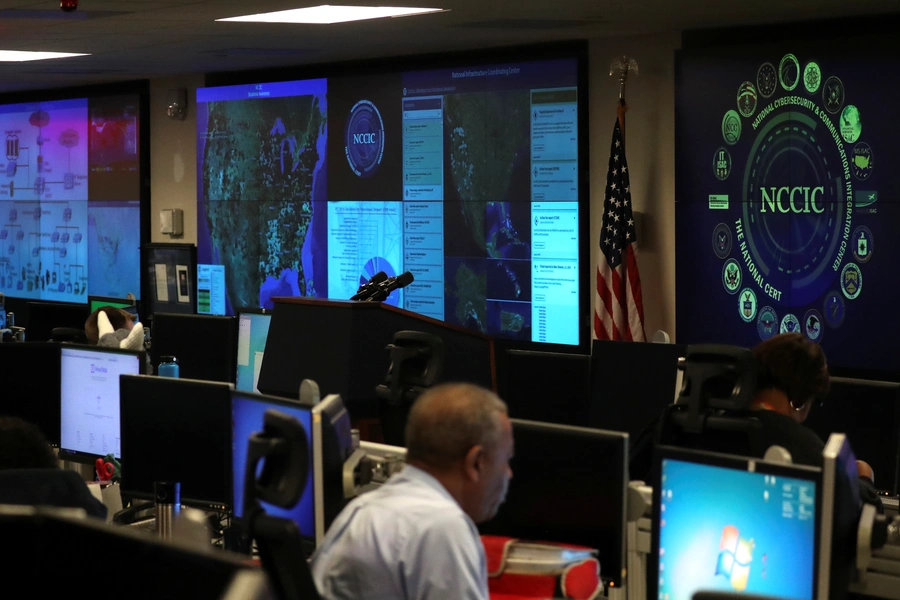 U.S. Department of Homeland Security elections security workers monitor screens in the DHS National Cybersecurity and Communications Integration Center (NCCIC) in Arlington, Virginia, U.S. November 6, 2018. 