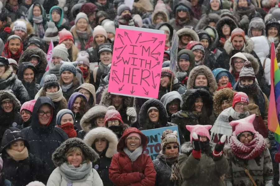 Participants listen to speakers outside City Hall during the Women's March in Toronto.