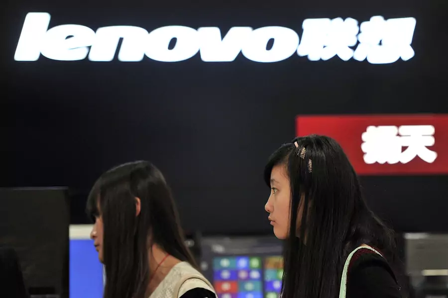 People walk past a Lenovo shop in Hefei, Anhui province