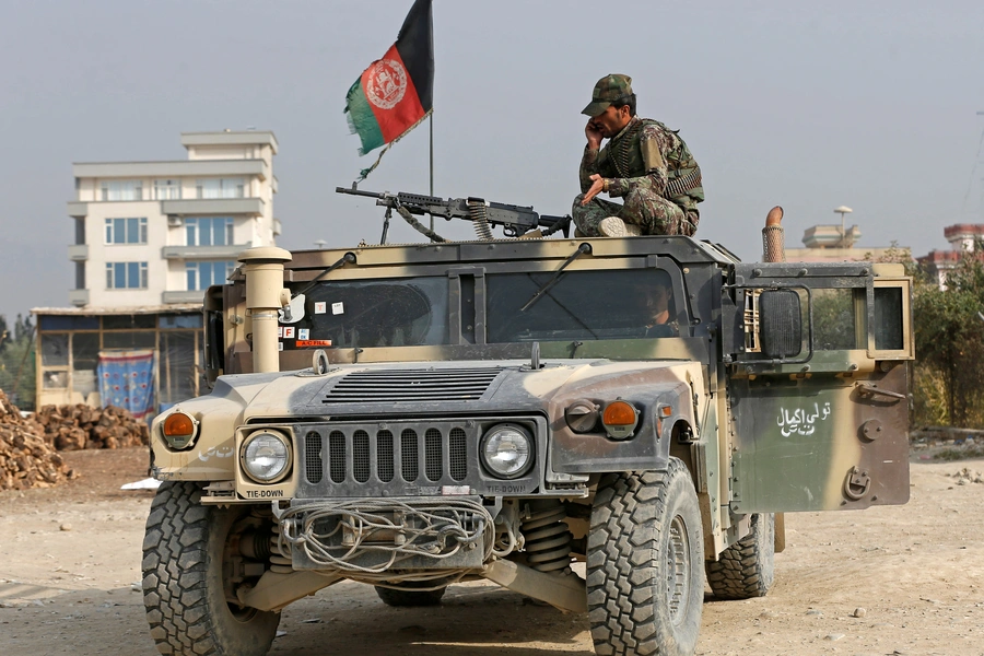 An Afghan National Army soldier keeps watch near the site of a suicide attack in Kabul, Afghanistan, on October 31, 2018. 