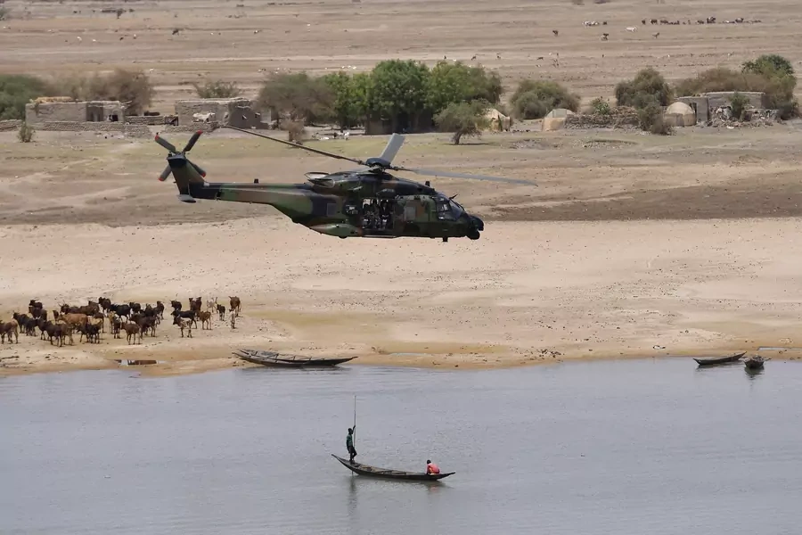 French President Emmanuel Macron's helicopter flies over Gao as he visits French troops in Africa's Sahel region in Gao, northern Mali, on May 19, 2017.