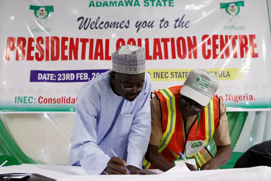 INEC state collation officers go over the declared figures before announcing the results of the presidential election at the State Office in Yola, in Adamawa State, Nigeria, on February 25, 2019.